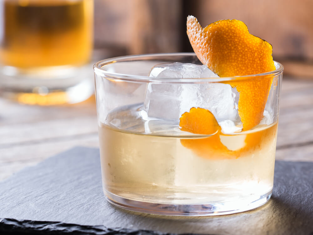 picture of cocktail glass with orange slice garnish