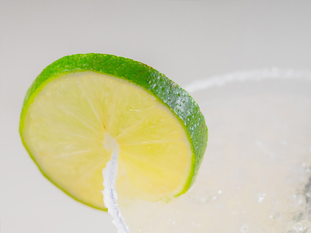 Paloma cocktail with a lime wedge